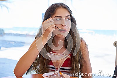 Brunette girl eating chocolate ice cream Stock Photo