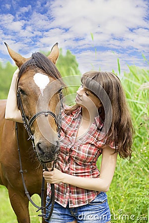 Brunette girl with horse Stock Photo