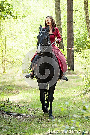Brunette girl on horse Stock Photo