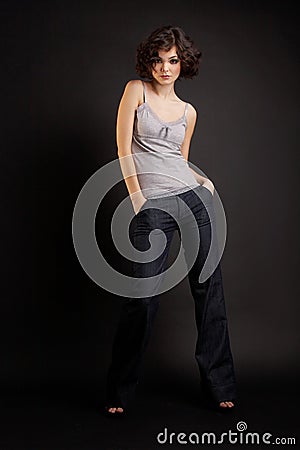 Brunette girl posing on dark background Stock Photo