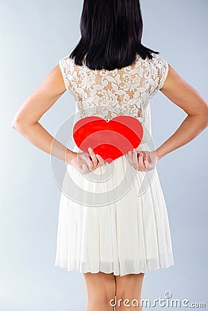 Brunette girl with red Valentine heart Stock Photo