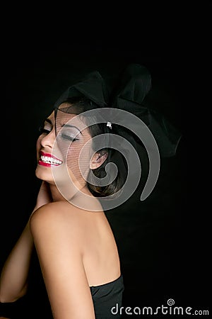 Brunette glamour fashion smiling over black Stock Photo