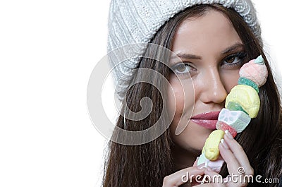 Brunette lady holding a candy skewer Stock Photo