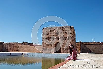 A lady smiling by a pond in Morocco Stock Photo
