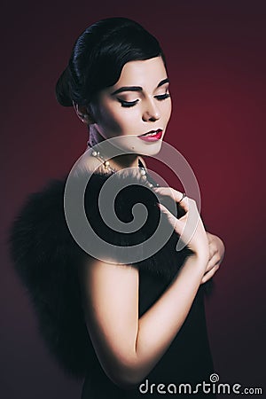Brunette Retro Woman with red lips make up and wave bang hairstyle and closed eyes Stock Photo