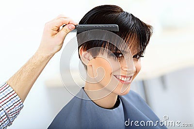 Brunette with Short Hair in Hair Salon. Stock Photo