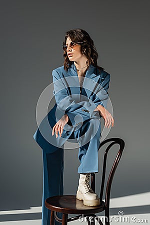 brunette woman in blue fashionable suit Stock Photo