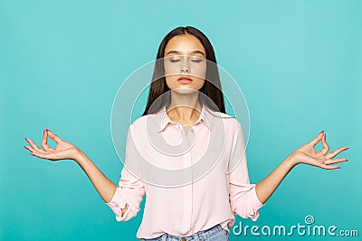 Brunette woman in a keep calm pose . Having a rest and meditating concept. Stock Photo