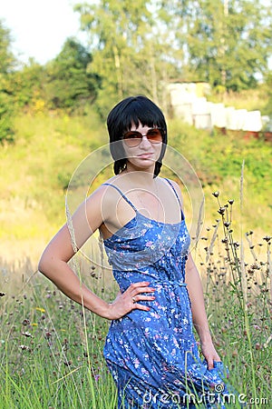 Brunette woman on meadow Stock Photo