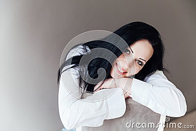 beautiful brunette woman in white portrait shirt Stock Photo