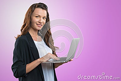 Brunnete woman holding laptop Stock Photo