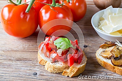 Bruschetta with beans and arugula, mushrooms, goat cheese Stock Photo