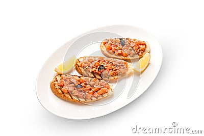 Bruschetta with salmon and avocado dried rye baguette, cream cheese, salmon, Tobiko caviar, avocado, basil . Isolated Stock Photo
