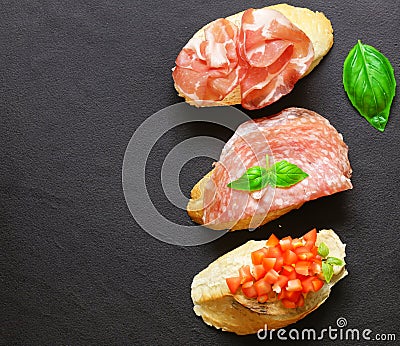 bruschetta sandwiches with ham and vegetables Stock Photo