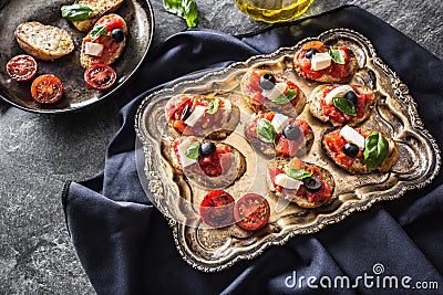 Bruschetta toast with mozzarella tomatoes olives Stock Photo