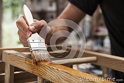 Brush applying varnish Stock Photo