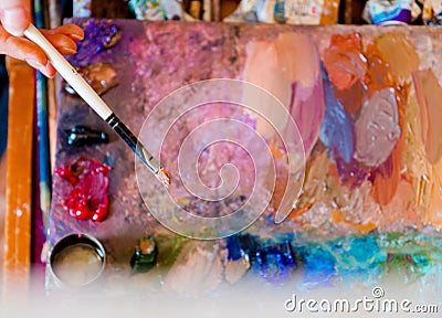 Brush artist and palette. Artist`s workshop. Stock Photo