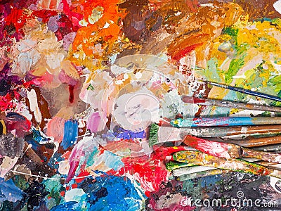 Brush and bright oil-paint palette for background Stock Photo