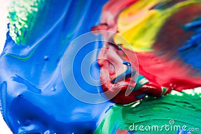 Brush mixing paint on palette Stock Photo