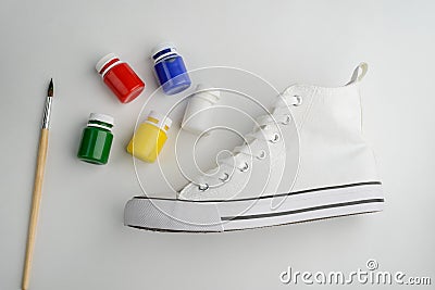 Brush, paint and blank sneaker Stock Photo