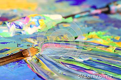 Brush and palette knife on painting Stock Photo