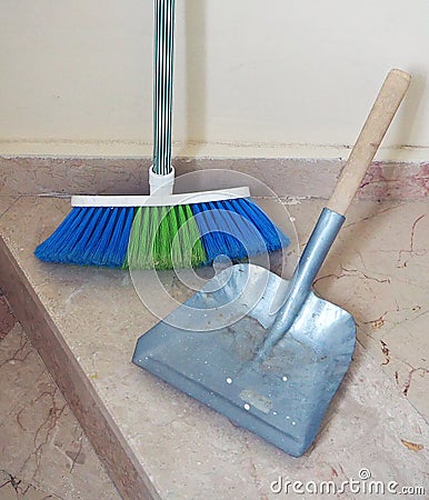 Brush and small shovel, building cleaning, cleaning of stairs and corridors Stock Photo