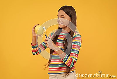 Brush it up. Happy child brush apple with toothbrush. Dental care. Vitamins for healthy strong teeth Stock Photo