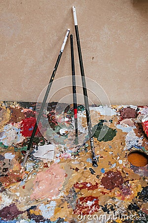 Brushes and paints for oil on canvas. Artist studio Stock Photo