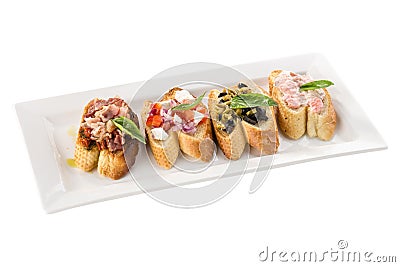 Brushetta set for wine Variety of small sandwiches appetizer on white plate isolated on white background Stock Photo