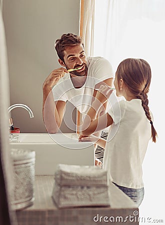 Brushing teeth, father learning and child in a bathroom at home in morning with dental cleaning. Oral hygiene, kids and Stock Photo