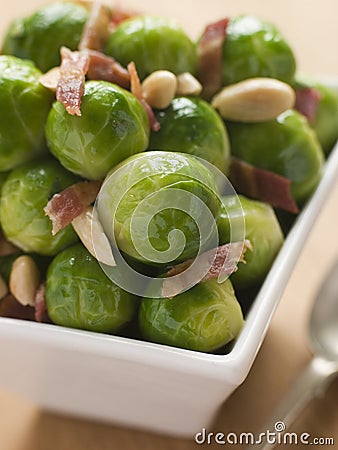 Brussel Sprouts with Fried Bacon and Almonds Stock Photo