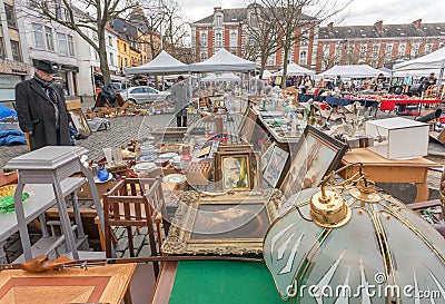 Customer of flea market and many old art, bargains and antique stuff in mess of vintage decor and retro details Editorial Stock Photo