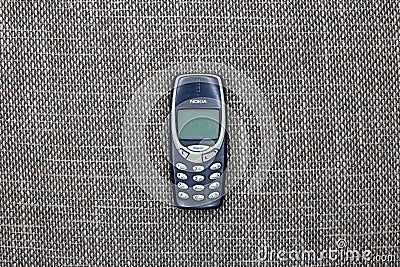 Brussels, Belgium - February 26, 2017 : The iconic Nokia 3310 mobile phone. Editorial Stock Photo