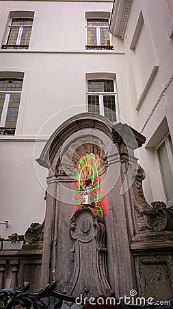 Brussels, Belgium - May 13, 2018: bronze fountain sculpture Manneken Pis in central Brussels Editorial Stock Photo