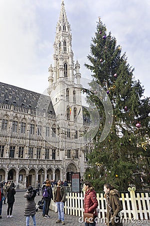 Brussels town hall building with high christmas three on sunny sunset winter Editorial Stock Photo