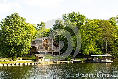 Brussels, Belgium: a wood coffee shop and a pier in La Cambre Park Editorial Stock Photo