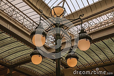 Art Nouveau lamp and glass ceiling in an old building, at Brussels. Editorial Stock Photo