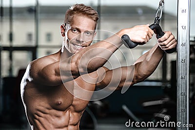 Brutal caucasian handsome fitness men on diet training triceps g Stock Photo