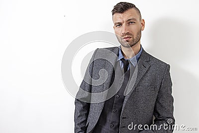 Brutal handsome man in elegant suit. Portrait of confidence man. Stock Photo