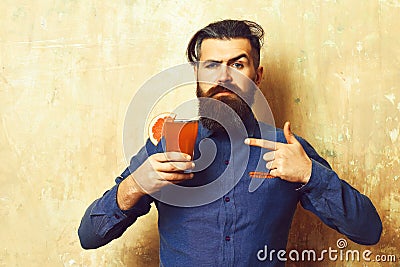 Brutal hipster holding tropical alcoholic fresh cocktail Stock Photo