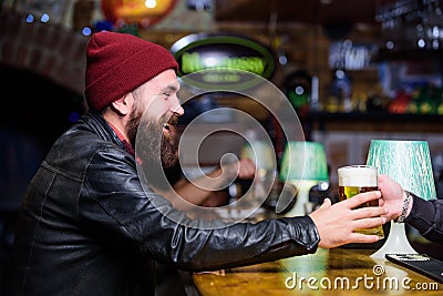 Brutal lonely hipster. Brutal hipster bearded man sit at bar counter. Friday evening. Bar is relaxing place to have Stock Photo