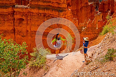 BRYCE CANYON, UTAH, JUNE, 07, 2018: Hikers in Bryce Canyon hiking in beautiful nature landscape with hoodoos, pinnacles Editorial Stock Photo