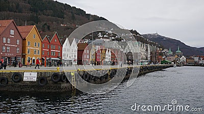 Bryggen and Byfjorden, with FlÃ¸ien and Ulriken in the background. Bergen, Norway. Editorial Stock Photo