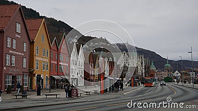 Bryggen, Bergen, Norway, with FlÃ¸ien and Ulriken mountains in the background. Editorial Stock Photo