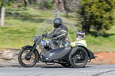 1948 BSA M21 Motorcycle with sidecar on country road Editorial Stock Photo