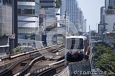 BTS Sky Train is running in downtown pass through skycrapers business building in Bangkok Editorial Stock Photo