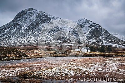 Buachaille Etive Mor and the iconic white cottage in Glencoe. Stock Photo