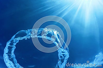 Bubble Ring Ascends towards the Sun, Underwater Stock Photo