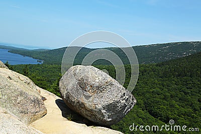 Bubble Rock on top of the South Bubble Mountain and Jordan Pond at Acadia National Park in Maine Stock Photo