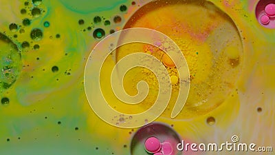 Bubbles float in liquid paint, mixing ink, oil and milk, abstract multicolor hypnotic painting Stock Photo